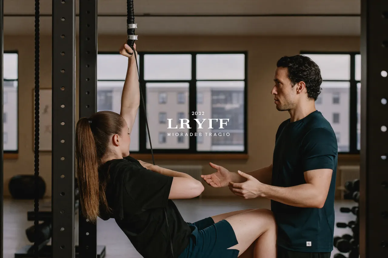 Personal trainer coaching a member in a modern boutique gym