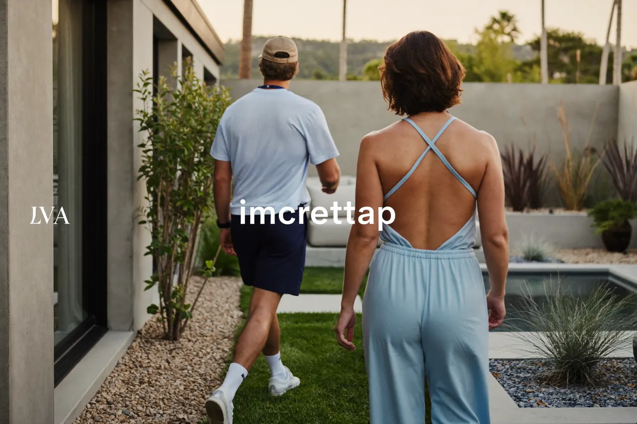 Landscape designer walking a homeowner through a finished contemporary backyard