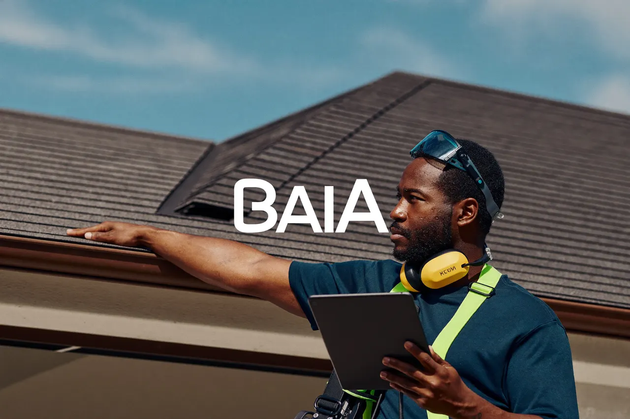 Roofing foreman inspecting a newly installed roof on a modern home